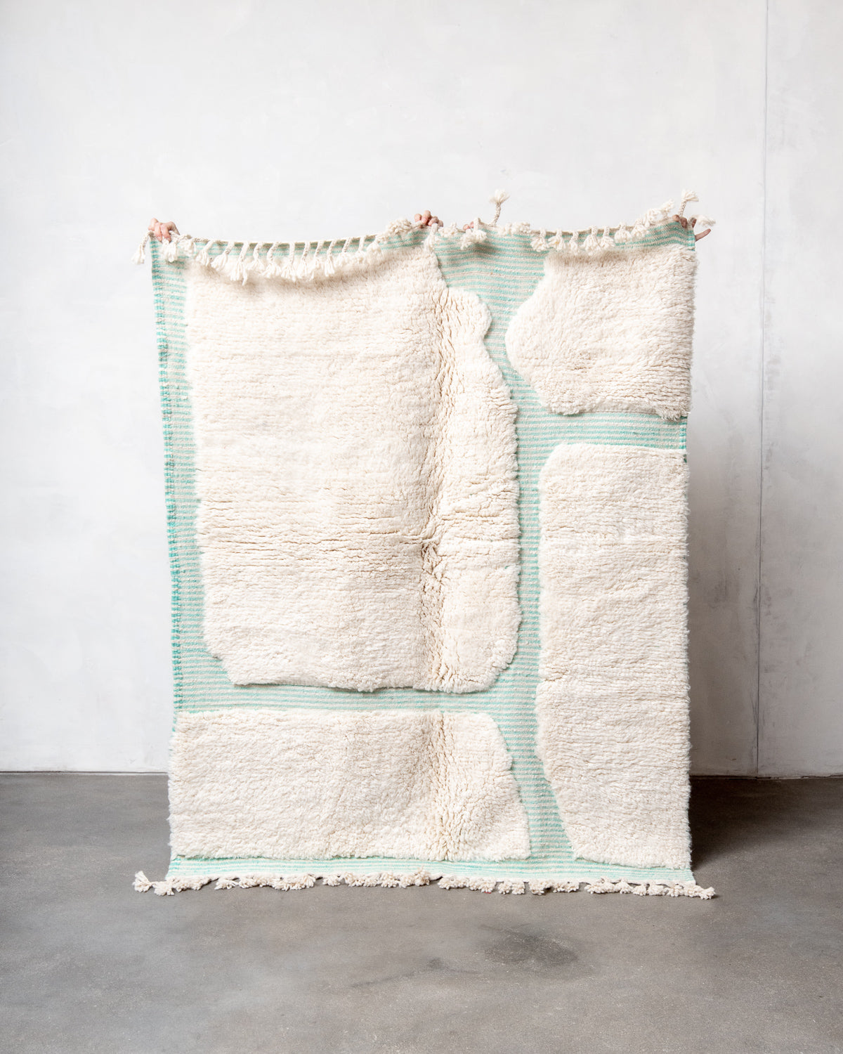Modern, designer, handcrafted Berber rug from Morocco. Beniourain carpet with beautiful colours and patterns and fluffy wool texture.